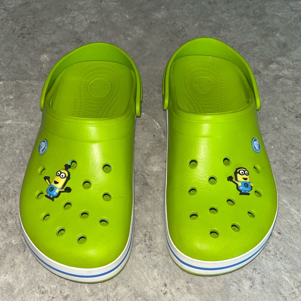 Green crocs with minion jibits